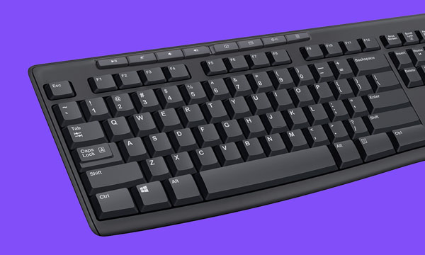 the half of Logitech MK270 keyboard in purple background