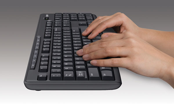 two hands are typing on Logitech MK270 keyboard