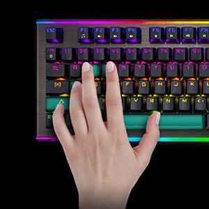 Rosewill NEON K75 V2 keyboard closeup with a hand using the WASD and spacebar