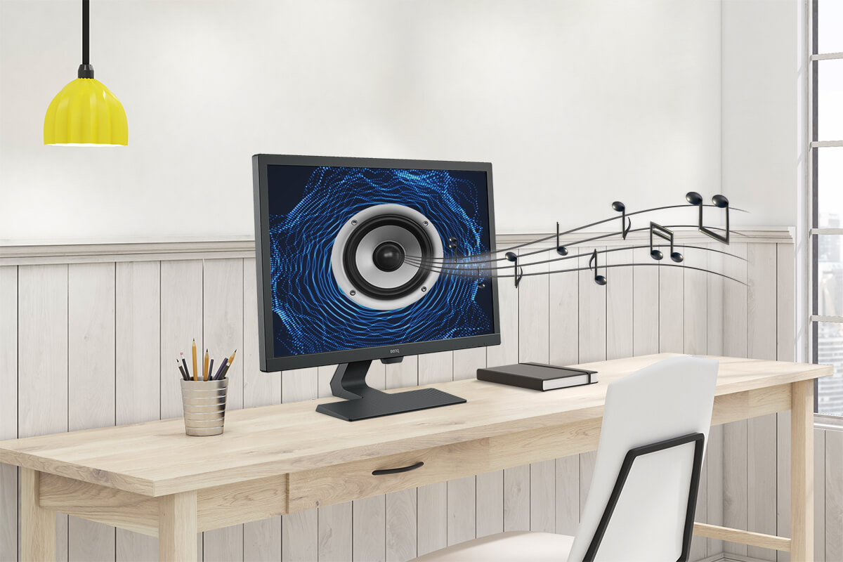 one monitor is playing music on a desktop