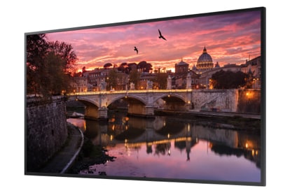 Samsung Display Angled to the Left Showing a Bridge over Water in Front of a Rustic Town During Twilight Hour