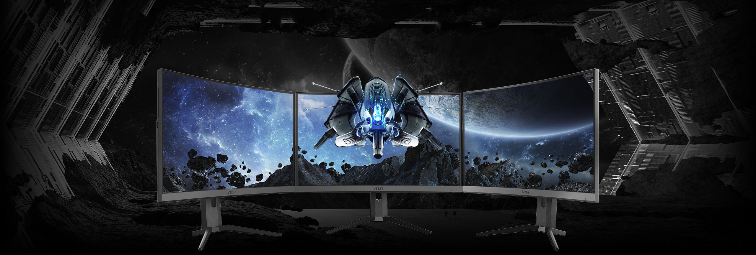 three monitors side-by-side with a space image as screen
