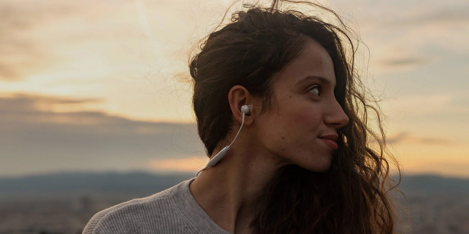 A girl wore Sennheiser HD 450BT Wireless Around Ear headphones