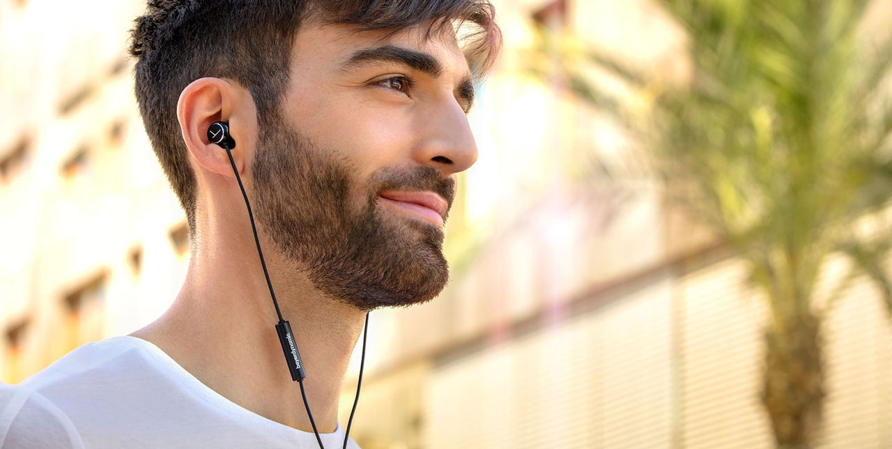A man wearing the beyerdynamic in-ear headphones