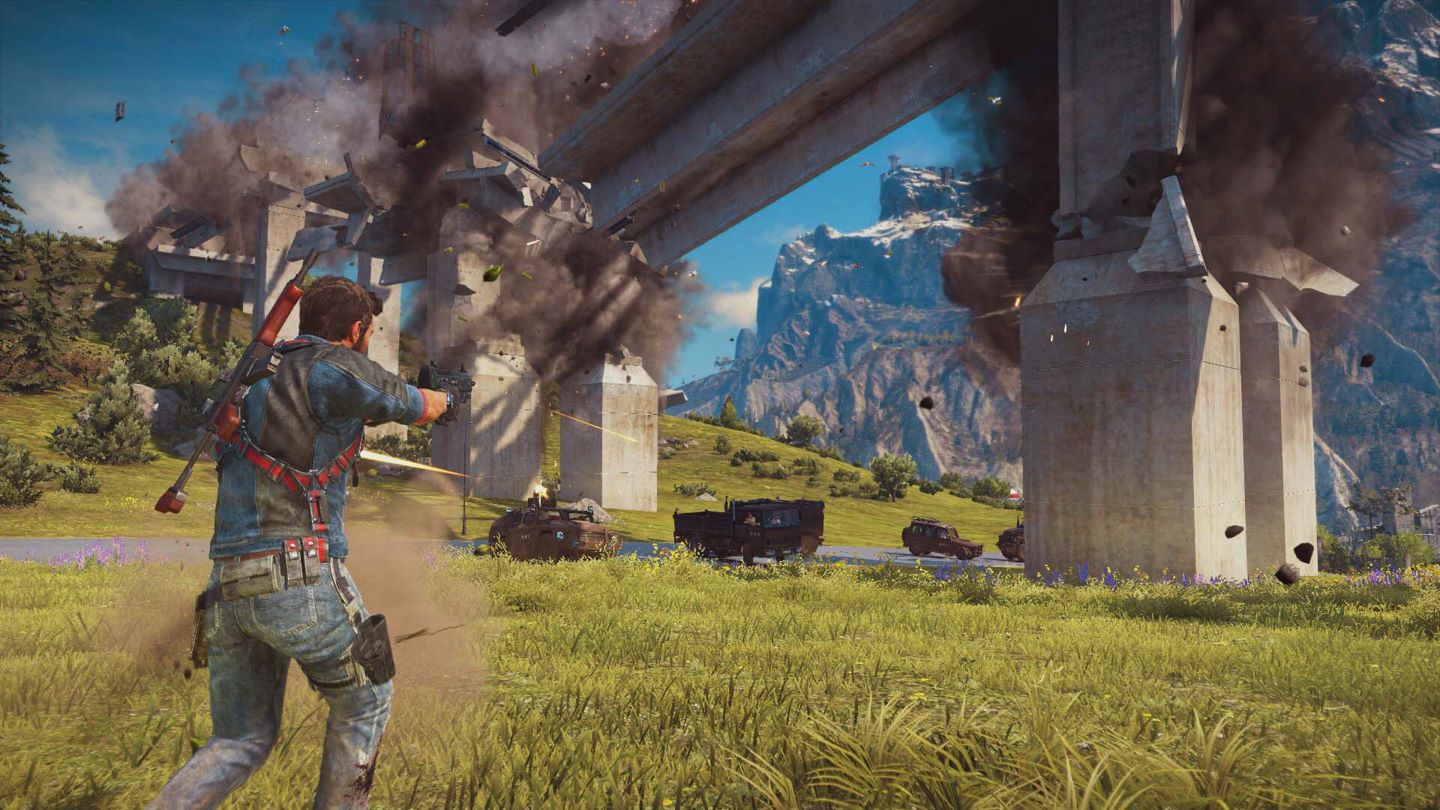 Just Cause 3 Screenshot Showing the Main Character with a Sub Machine Gun Shootign Towards Vehicle Under a Collapsing Concrete Bridge