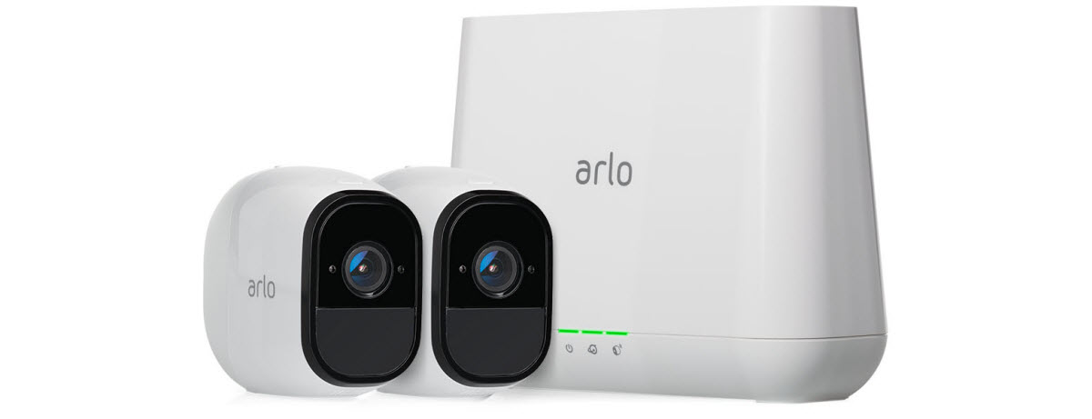 two Arlo Pro security cameras and a Arlo base