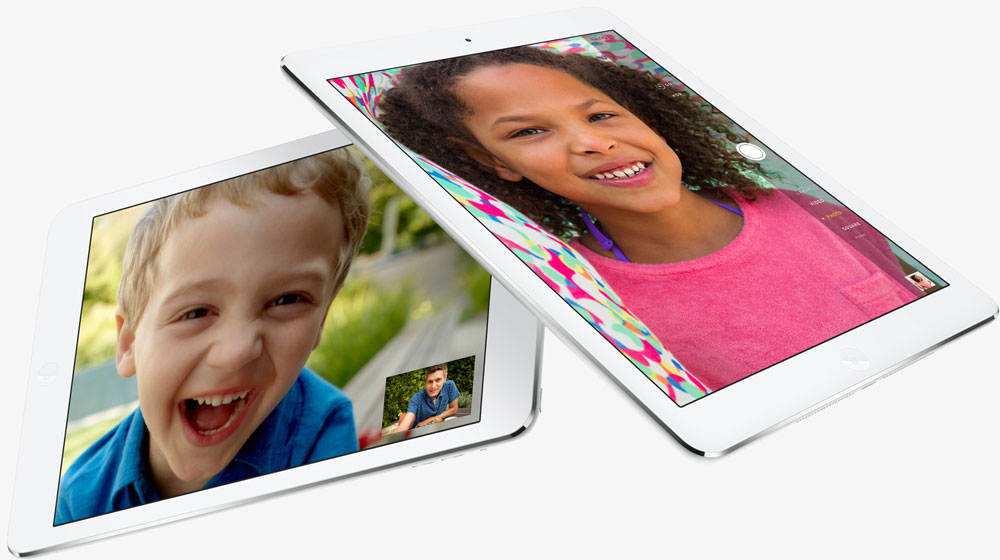 Two iPad Air, with one partially stacking over the other one. Screen of each iPad Air shows interface of video chat.
