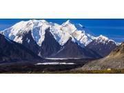 Panorama view of Mt Brooks (nearest snow-capped mountain) and Denali (behind) towering over the Muldrow Glacier in Denali National Park Alaska United States of Panorama view of Mt Brooks (nearest snow-capped mountain) and Denali (behind) towering over the Muldrow Glacier in Denali National Park Alaska United States of
