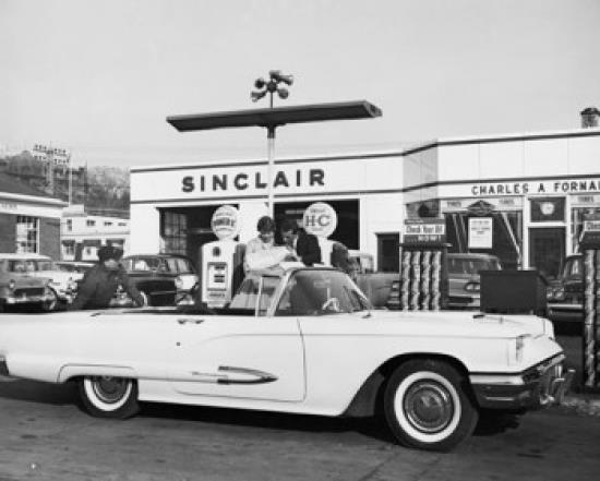 Man refueling a car at a gas station Poster Print (18 x 24)