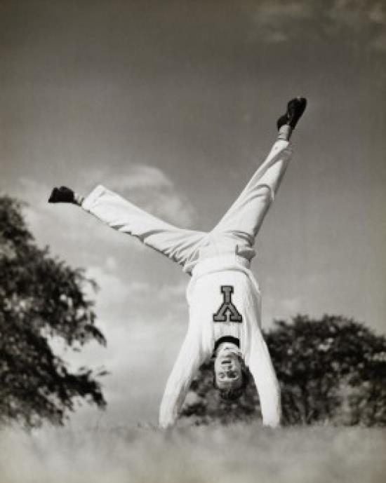 Male cheerleader doing a cartwheel Poster Print (18 x 24)