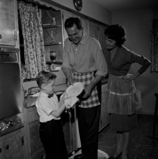 Parents and son washing dishes Poster Print (18 x 24)