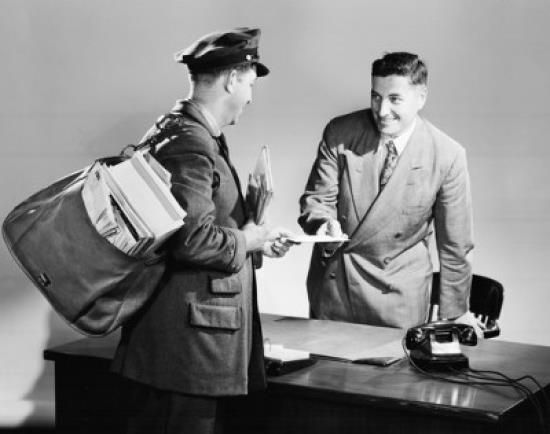 Side profile of a postman giving mail to a businessman Poster Print (18 x 24)